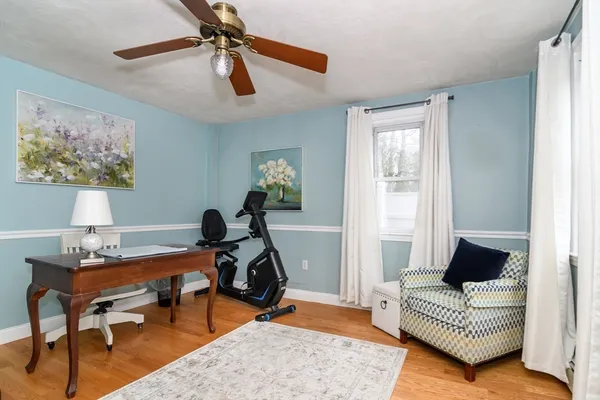 a living room with furniture and a rug