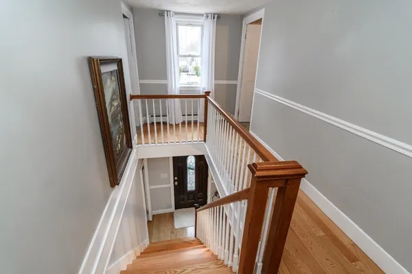 a view of entryway with wooden floor