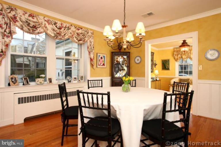 105 Enfield Road Baltimore, MD 21212 - Photo 22 of 28 a view of a dining room with furniture and wooden floor