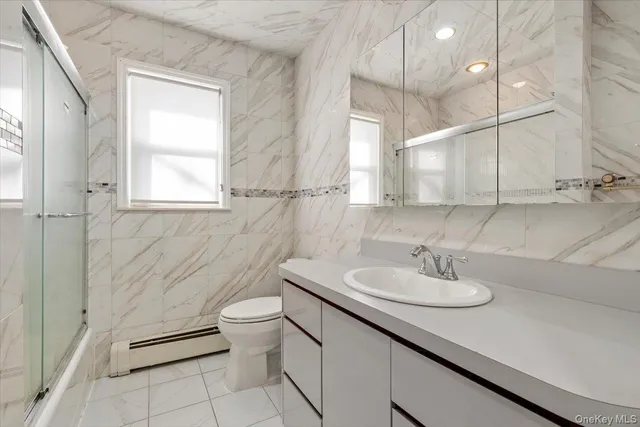 a bedroom with bed and window