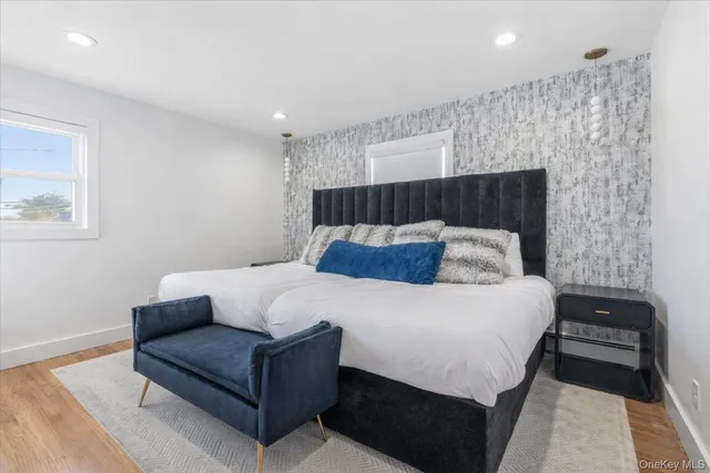 a bedroom with a bed and a couch