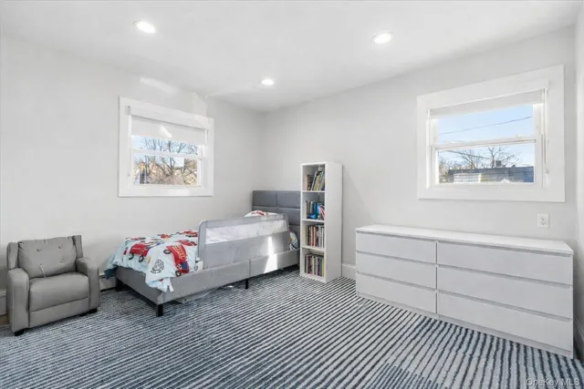 a view of an empty room with a flat screen tv