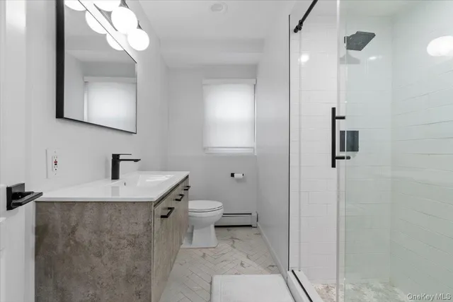 a bedroom with a bed and a cabinets