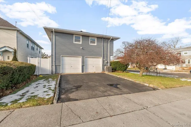 a view of a house with backyard and porch