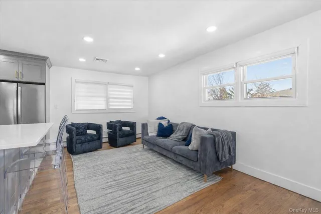 a kitchen with a refrigerator and a sink