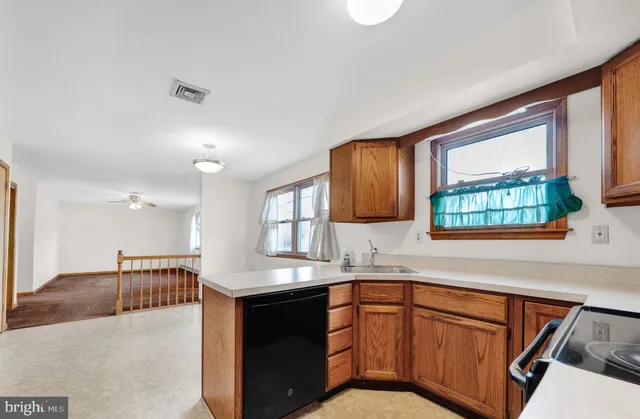 a utility room with cabinets washer and dryer