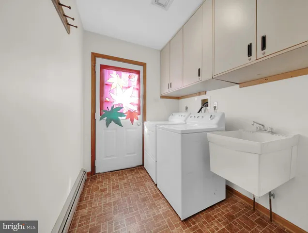 a bathroom with a sink toilet vanity and bathtub
