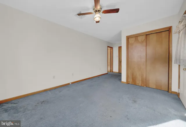 a white toilet sitting next to a bathroom sink
