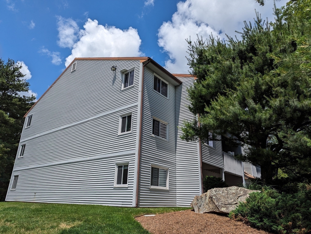 809 Franklin Crossing Road, Unit 809 Franklin, MA 02038 - Photo 15 of 15 a front view of a house with a yard