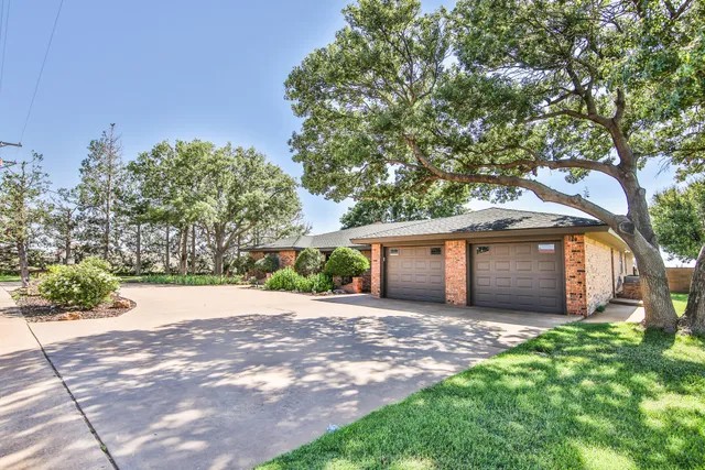 a wooden house with tree in front of it