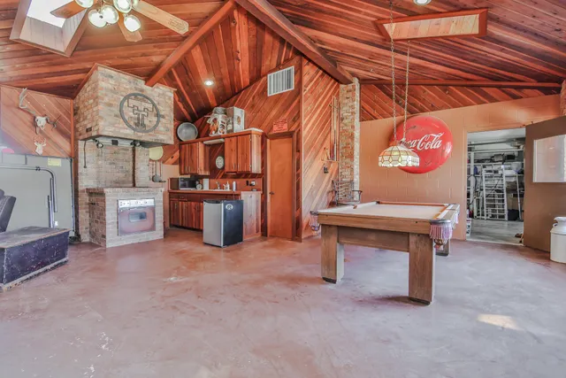 a view of a room with chairs and a clock