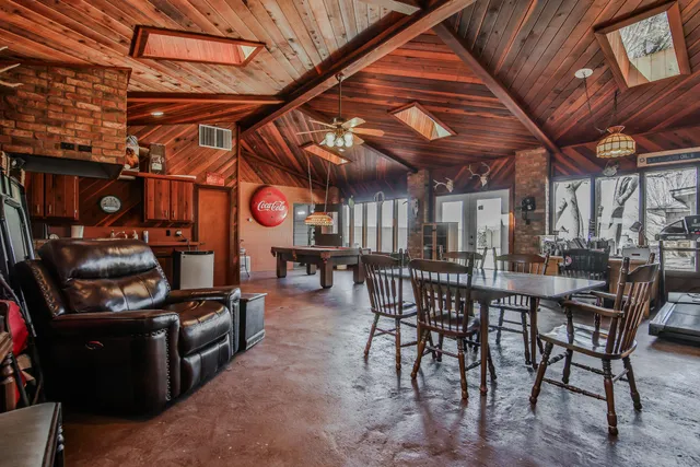 a view of a chairs and table in the patio