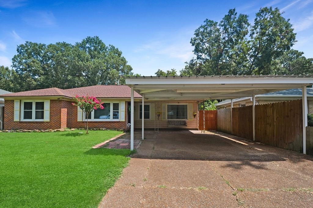 1514 Ivy Road Memphis, TN 38117 - Photo 1 of 30 a front view of house with yard and green space