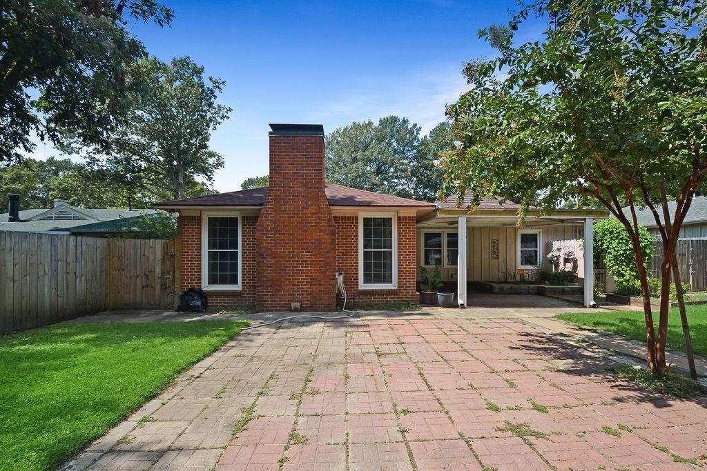 1514 Ivy Road Memphis, TN 38117 - Photo 28 of 30 a front view of a house with a garden