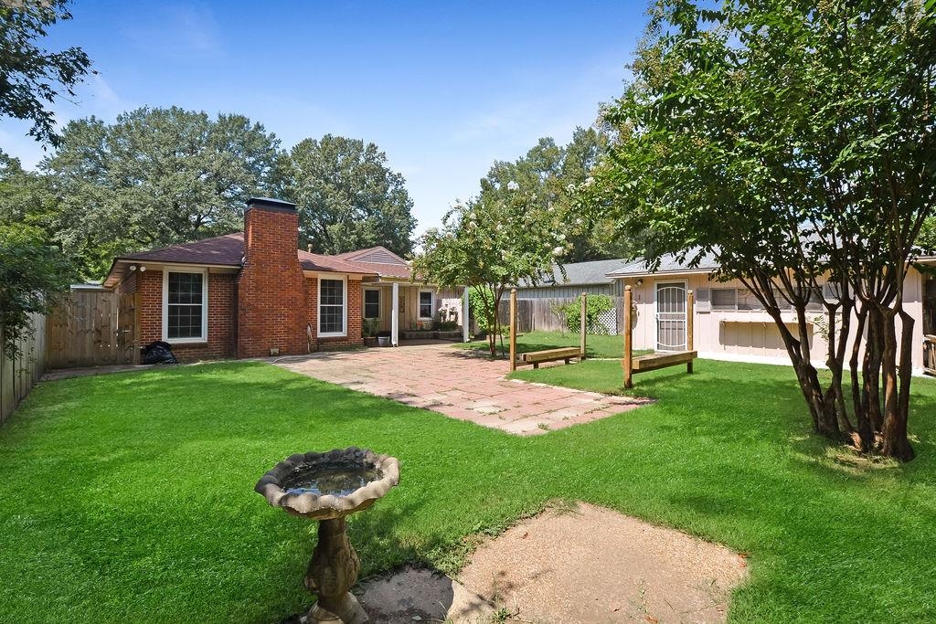 1514 Ivy Road Memphis, TN 38117 - Photo 29 of 30 a front view of a house with a yard and porch