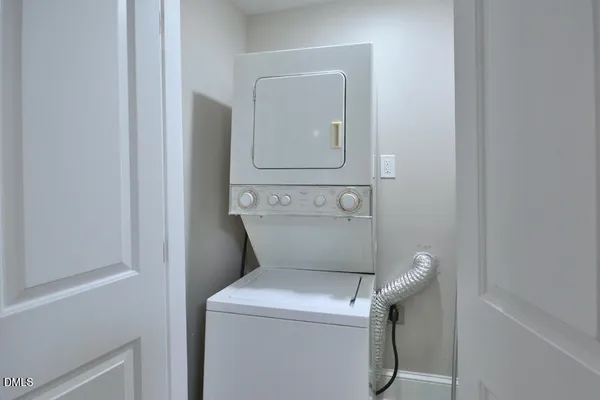 a bathroom with a granite countertop sink a mirror and a shower