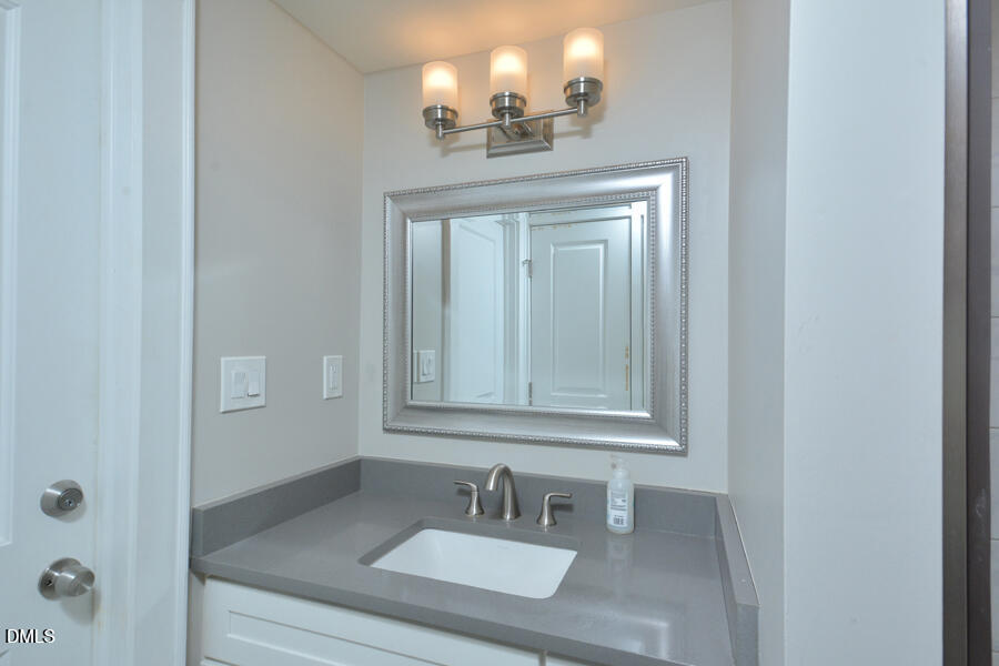 1900 Sunset Avenue Durham, NC 27705 - Photo 14 of 15 a bathroom with a sink and a mirror