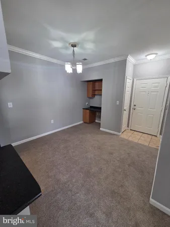 a kitchen with a stove and a refrigerator