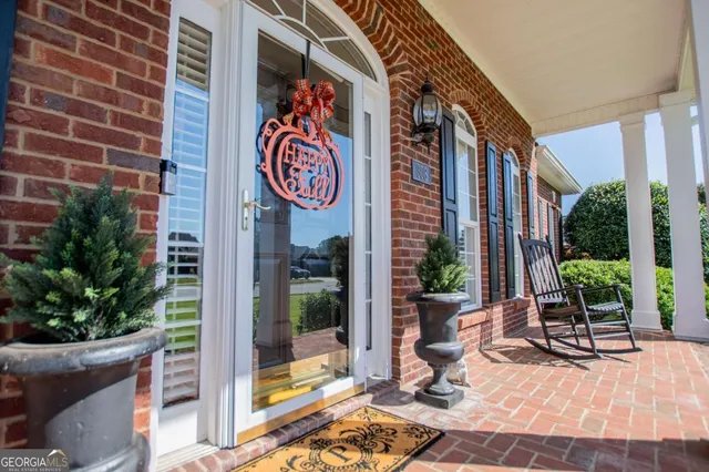 a view of a street with potted plants
