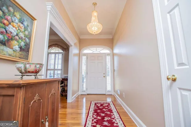 a view of gallery with wooden floor
