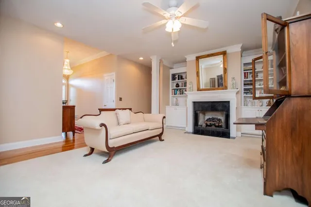 a living room with furniture and a fireplace