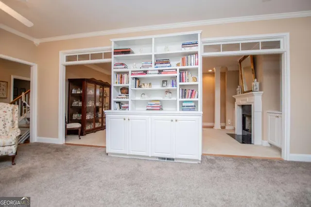 a view of living room with furniture and closet