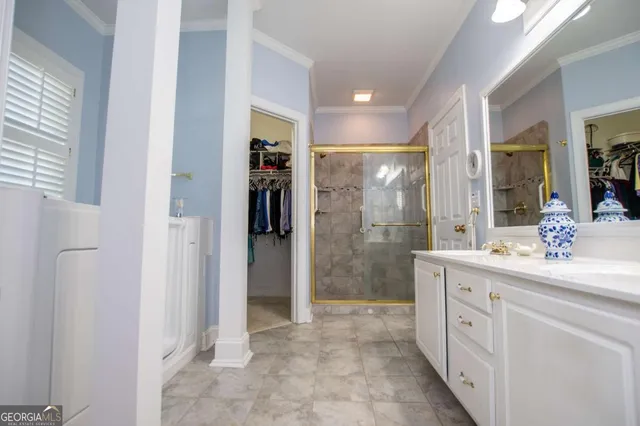 a spacious bathroom with a shower and a sink