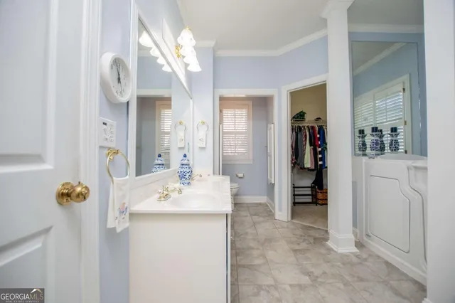 a bathroom with a sink vanity and mirror
