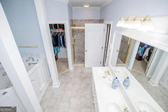 a view of a living room with furniture and a flat screen tv