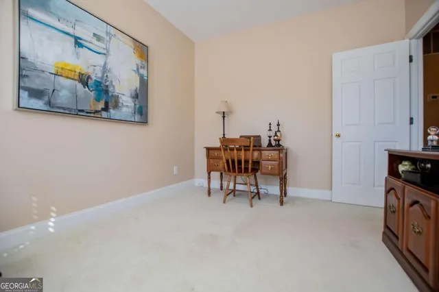 a view of a workspace with furniture