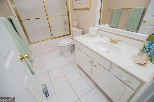 a spacious bathroom with a sink and a mirror