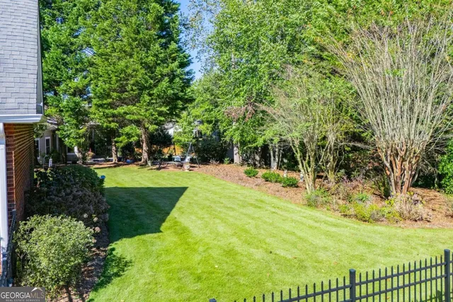 a view of a park with large trees