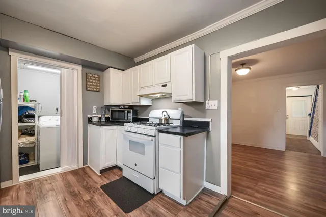 a kitchen with stainless steel appliances granite countertop a stove and a refrigerator