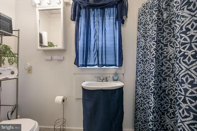 a bedroom with a bed and a tv