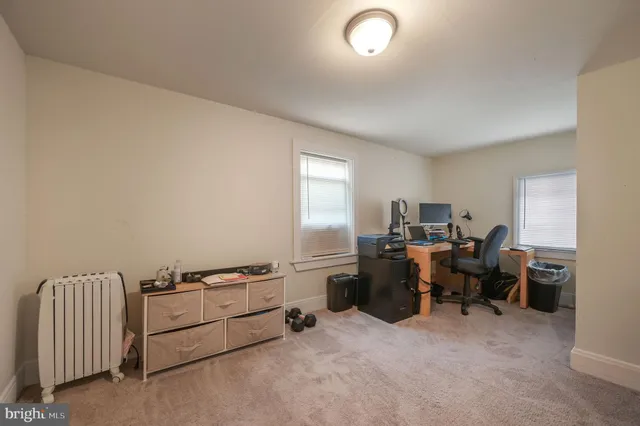 a view of a workspace with furniture