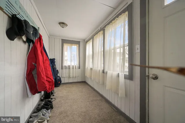 a view of an empty room with stairs