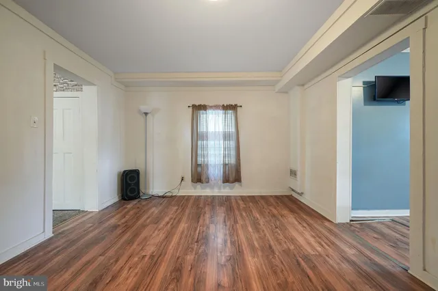 a kitchen with appliances a sink and cabinets