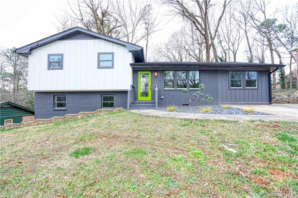 4406 Kimball Road Southwest Atlanta, GA 30331 - Photo 1 of 1 a front view of a house with a yard