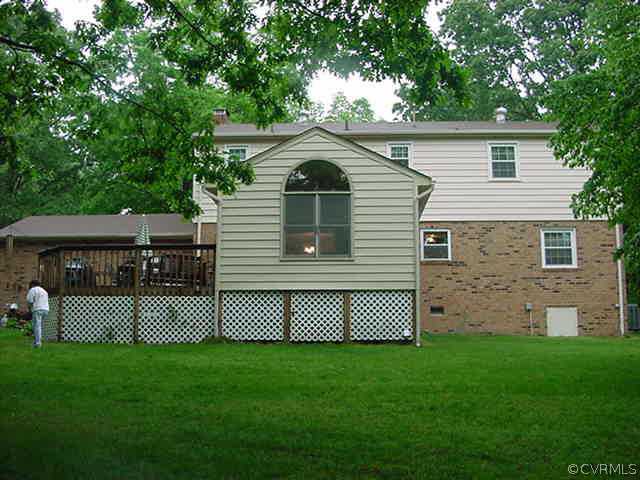 11000 Surry Road Chester, VA 23831 - Photo 3 of 10 a front view of a house with a garden