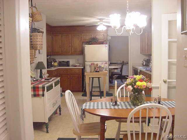 11000 Surry Road Chester, VA 23831 - Photo 5 of 10 a dining room with furniture and chandelier