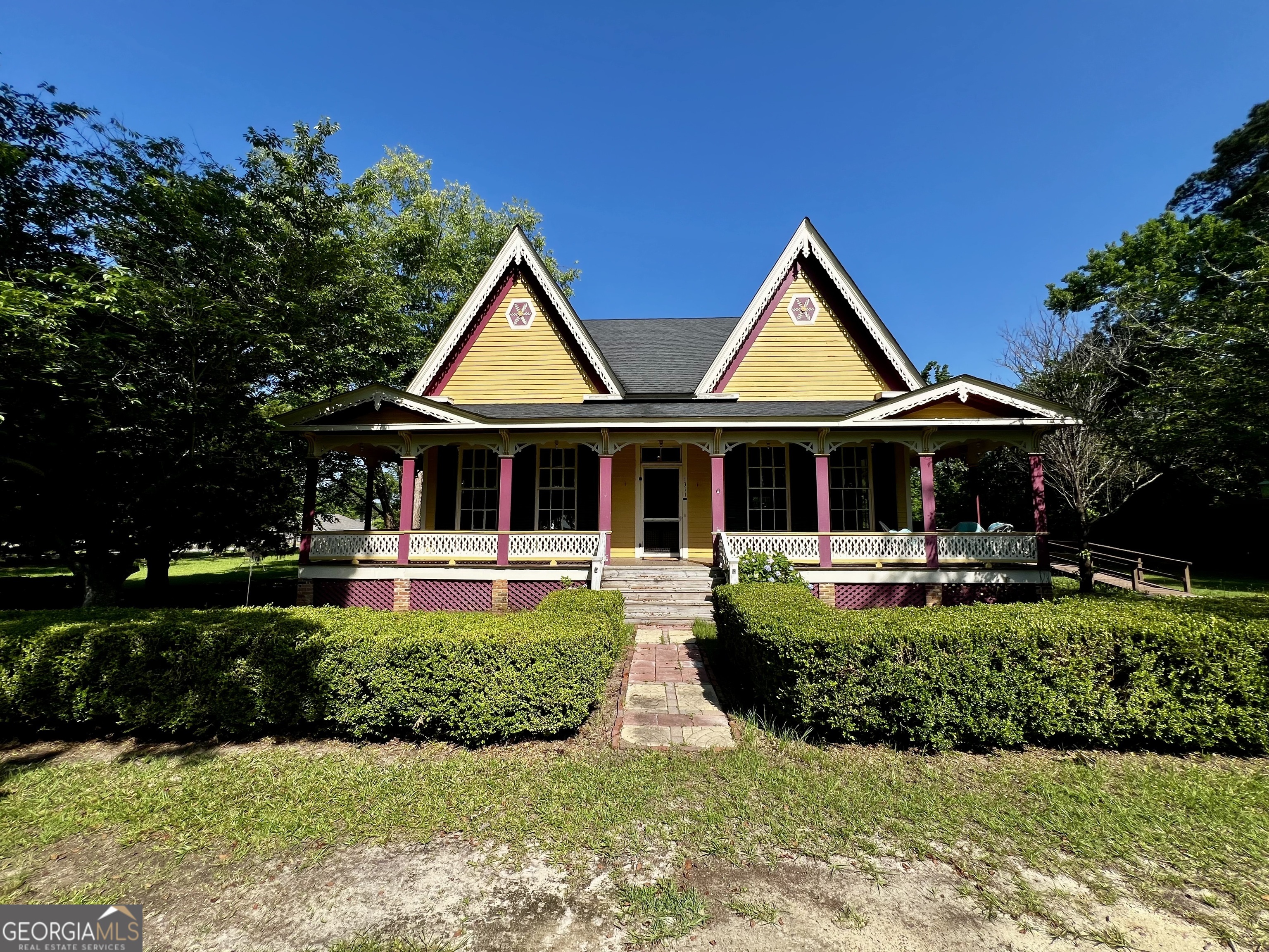 1311 3rd Street Dudley, GA 31022 - Photo 1 of 43 a front view of a house with swimming pool having outdoor seating