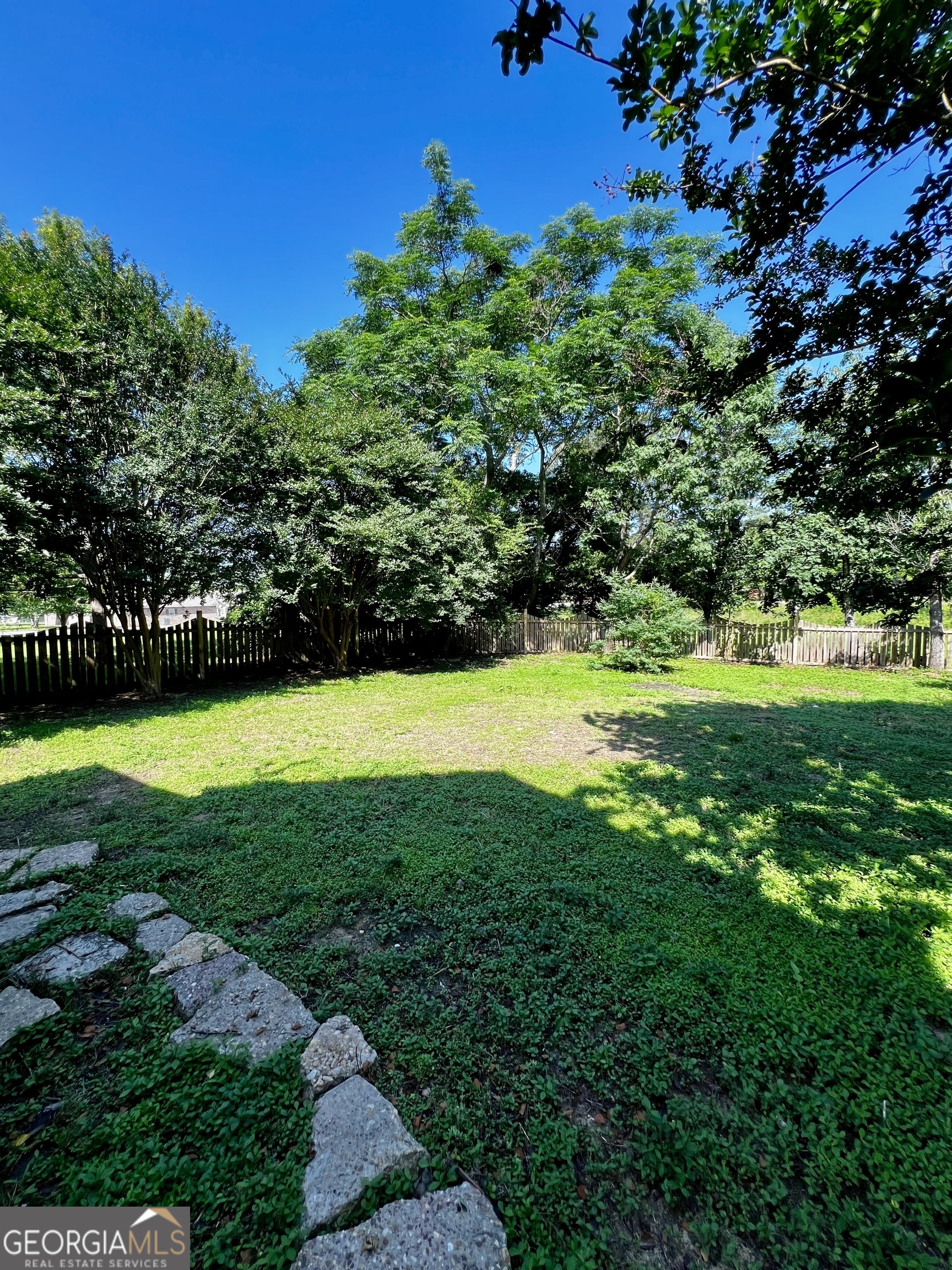 1311 3rd Street Dudley, GA 31022 - Photo 11 of 43 a view of a golf course with a garden