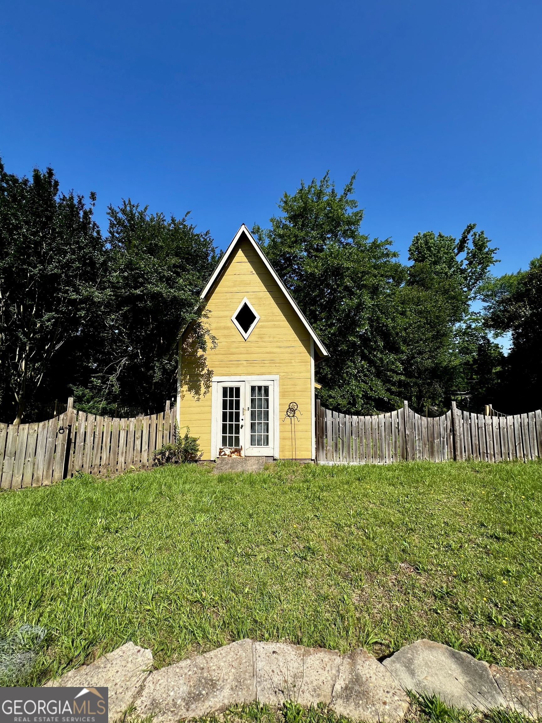 1311 3rd Street Dudley, GA 31022 - Photo 13 of 43 a view of a house with a yard