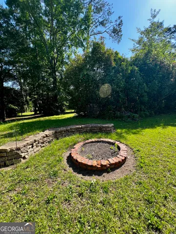 a view of a swimming pool and a yard