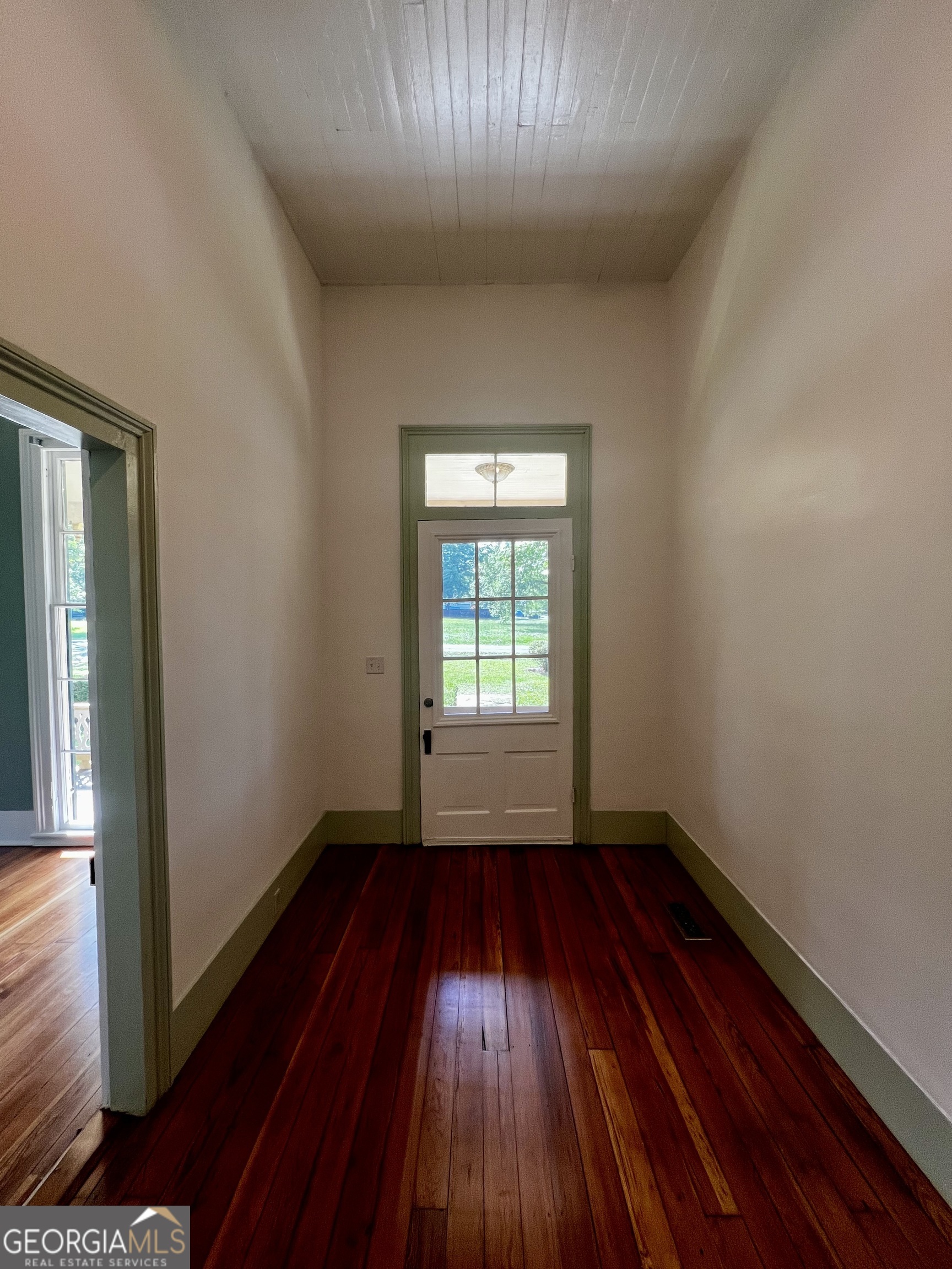 1311 3rd Street Dudley, GA 31022 - Photo 17 of 43 wooden floor in an empty room with a window