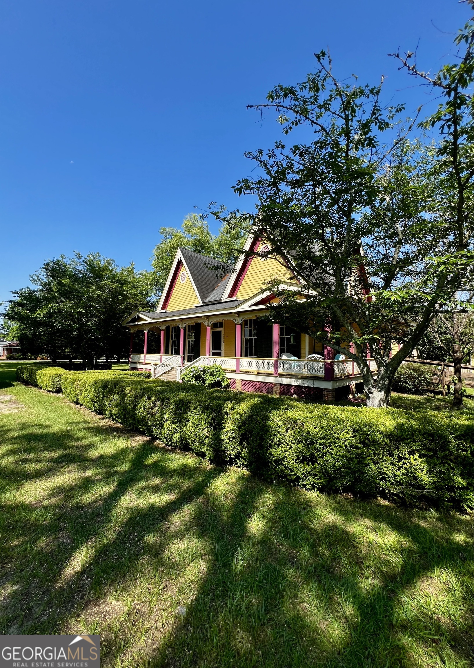 1311 3rd Street Dudley, GA 31022 - Photo 2 of 43 a front view of a house with a garden