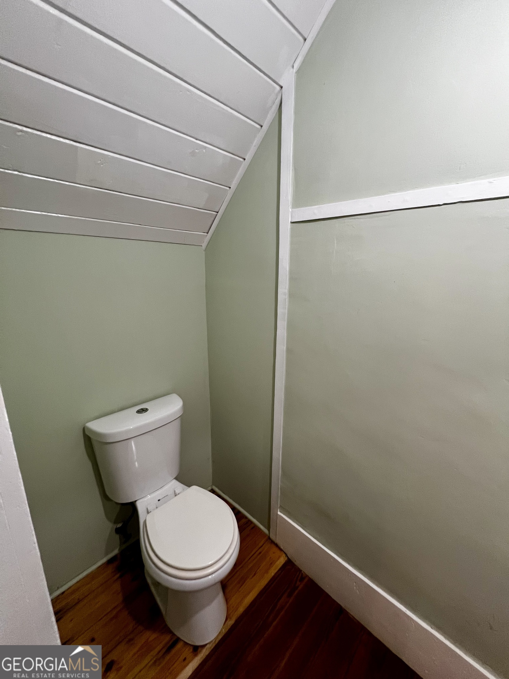 1311 3rd Street Dudley, GA 31022 - Photo 22 of 43 a white toilet sitting next to a shower