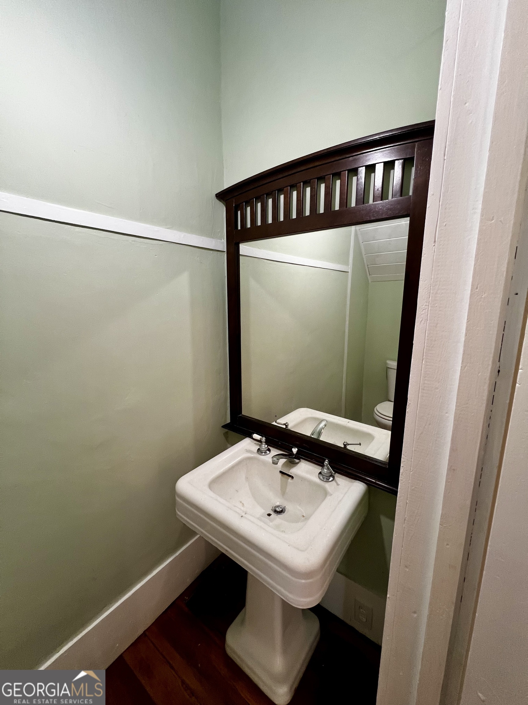 1311 3rd Street Dudley, GA 31022 - Photo 23 of 43 a bathroom with a sink and a mirror
