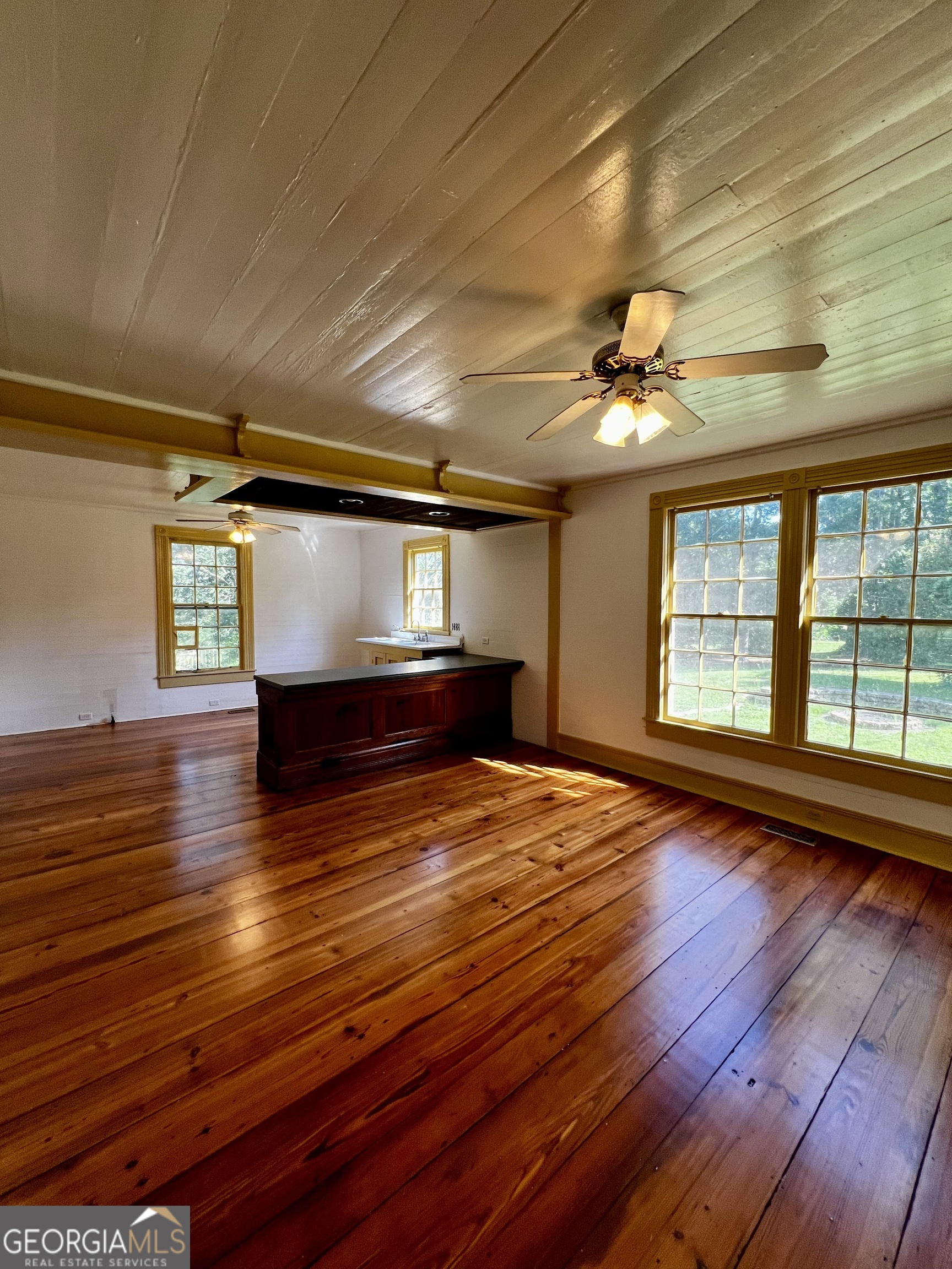 1311 3rd Street Dudley, GA 31022 - Photo 24 of 43 a view of empty room with wooden floor and fan