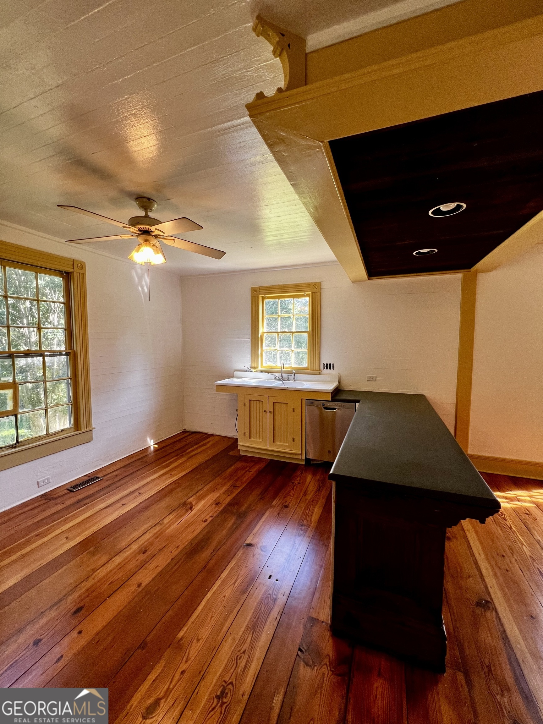 1311 3rd Street Dudley, GA 31022 - Photo 27 of 43 a living room with a bed furniture and a window